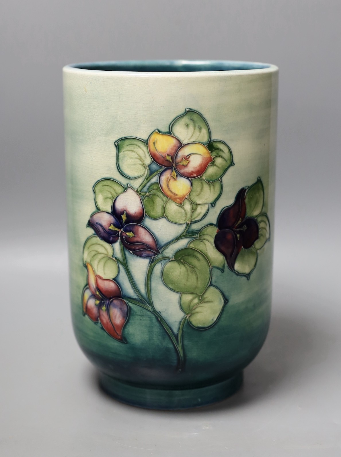 A large Moorcroft cylindrical vase, 25cm